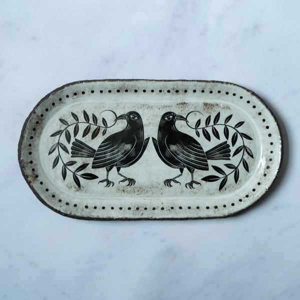 Two birds serving plate with leaves